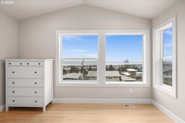 35505 Upper Loop Rd, Pacific City, OR 97135 - bedroom with light wood finished floors, vaulted ceiling, and baseboards