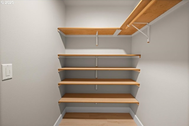 35505 Upper Loop Rd, Pacific City, OR 97135 - spacious closet featuring wood finished floors