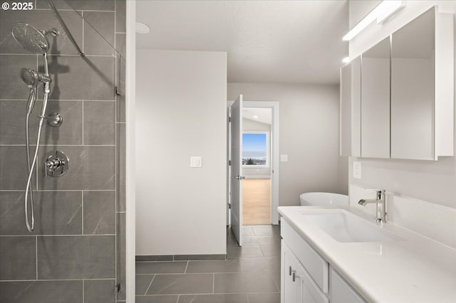 35505 Upper Loop Rd, Pacific City, OR 97135 - bathroom featuring vanity, a tile shower, tile patterned floors, and baseboards