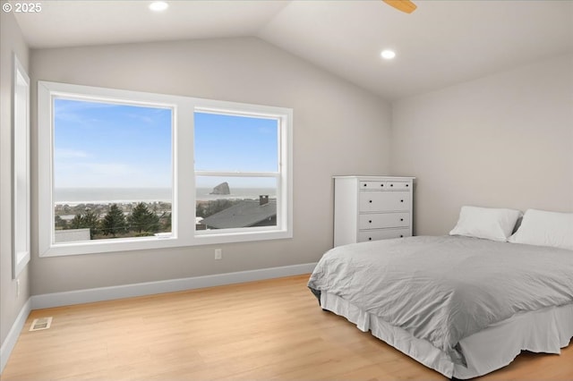 35505 Upper Loop Rd, Pacific City, OR 97135 - bedroom featuring multiple windows, light wood-style flooring, baseboards, vaulted ceiling, and recessed lighting