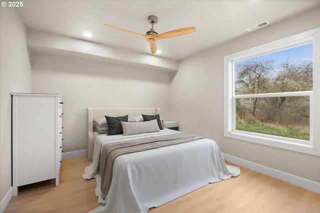35505 Upper Loop Rd, Pacific City, OR 97135 - bedroom with multiple windows, light wood-style flooring, baseboards, recessed lighting, and ceiling fan