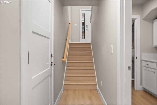 35505 Upper Loop Rd, Pacific City, OR 97135 - stairway with wood finished floors and baseboards