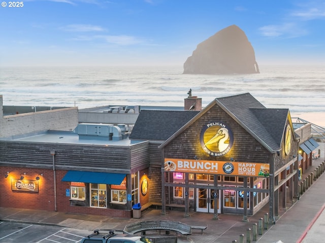 35505 Upper Loop Rd, Pacific City, OR 97135 - view of building exterior featuring a water view and uncovered parking
