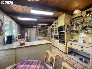 53742 Rosa Rd, Bandon, OR 97411 - kitchen with wood ceiling with exposed beams, black microwave, stainless steel oven, a peninsula, and open shelves