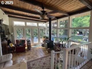 53742 Rosa Rd, Bandon, OR 97411 - sunroom / solarium featuring french doors, a wood stove, and beamed ceiling