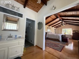 53742 Rosa Rd, Bandon, OR 97411 - bedroom featuring wood ceiling, light wood finished floors, and a sink