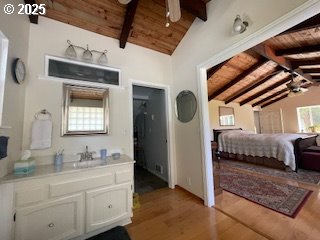 53742 Rosa Rd, Bandon, OR 97411 - bedroom with wooden ceiling, wood finished floors, and a sink