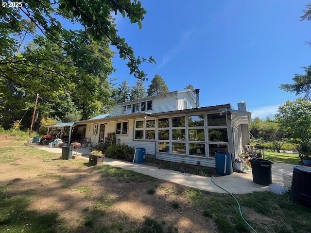 53742 Rosa Rd, Bandon, OR 97411 - back of house featuring cooling unit
