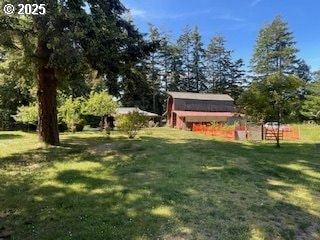 53742 Rosa Rd, Bandon, OR 97411 - view of grassy yard with an outdoor structure