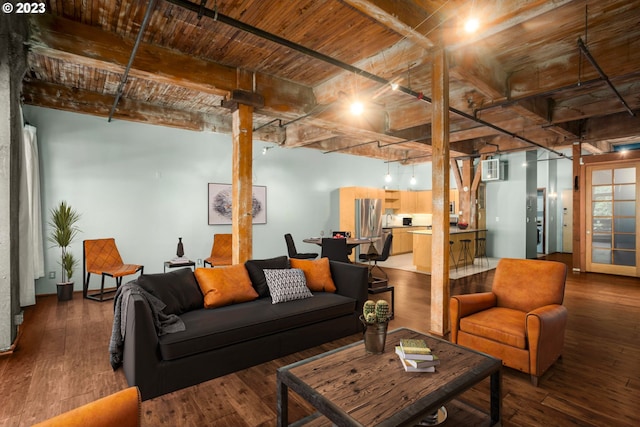 living room with a wall mounted air conditioner, dark hardwood / wood-style floors, and wood ceiling