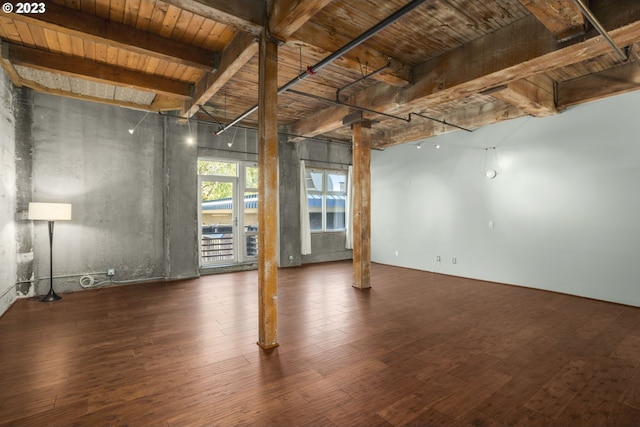 unfurnished room with beam ceiling, dark hardwood / wood-style floors, and wood ceiling