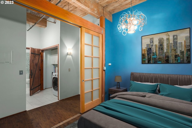 bedroom featuring wooden ceiling, beamed ceiling, washer / clothes dryer, a chandelier, and wood-type flooring