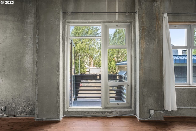 doorway to outside with hardwood / wood-style floors