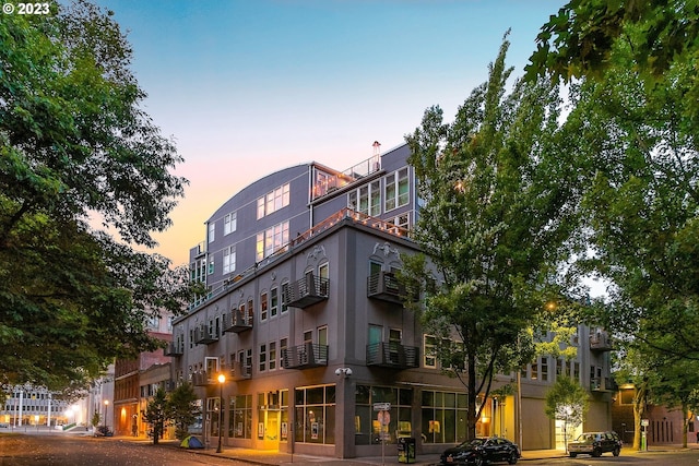 view of outdoor building at dusk