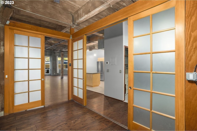 spare room featuring dark hardwood / wood-style floors and french doors