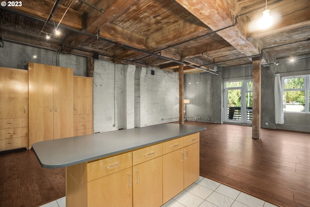 basement featuring light tile patterned flooring