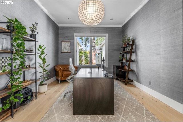 office space featuring crown molding, wood finished floors, a chandelier, and baseboards
