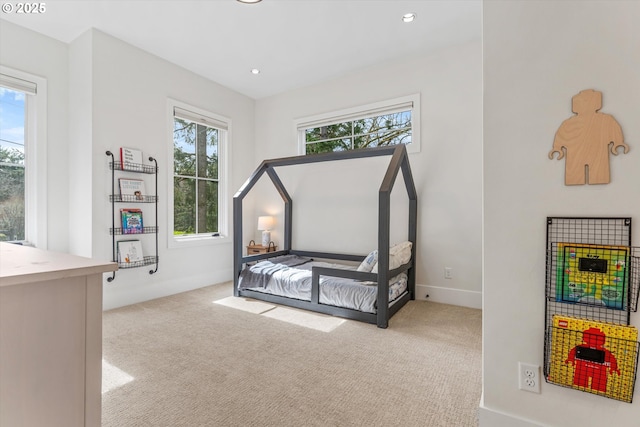 unfurnished bedroom with carpet flooring, recessed lighting, and baseboards