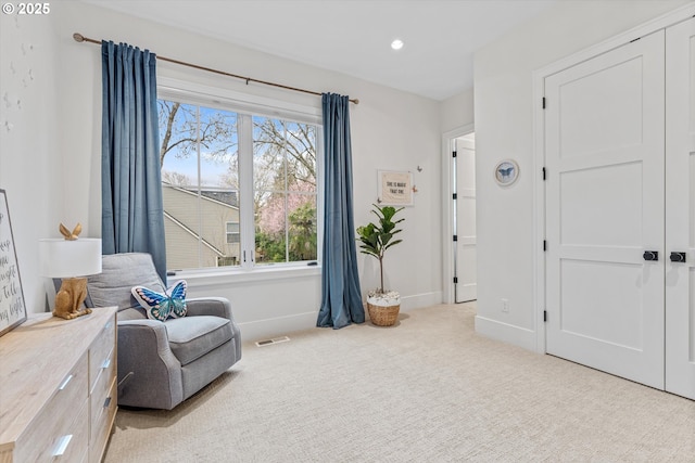 living area with carpet, healthy amount of natural light, baseboards, and recessed lighting