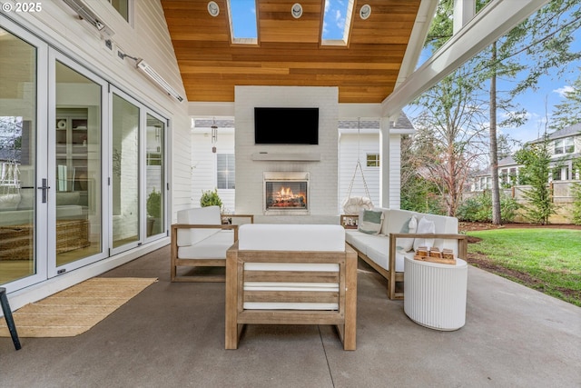 view of patio / terrace featuring an outdoor living space with a fireplace