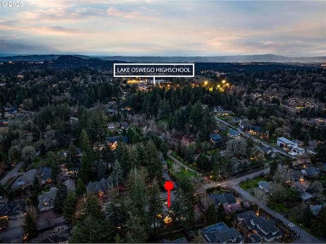 aerial view of property and surrounding area with mountains