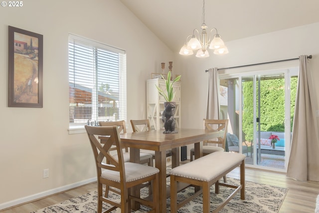 1281 Alderdale Dr, Junction City, OR 97448 - dining room with a chandelier, plenty of natural light, light wood-style flooring, lofted ceiling, and baseboards