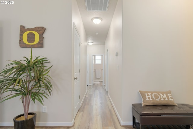 1281 Alderdale Dr, Junction City, OR 97448 - hallway with light wood-style flooring and baseboards