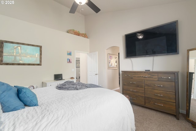 1281 Alderdale Dr, Junction City, OR 97448 - carpeted bedroom with arched walkways, a high ceiling, and ceiling fan