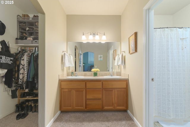 1281 Alderdale Dr, Junction City, OR 97448 - bathroom with double vanity, a shower with curtain, baseboards, and a walk in closet