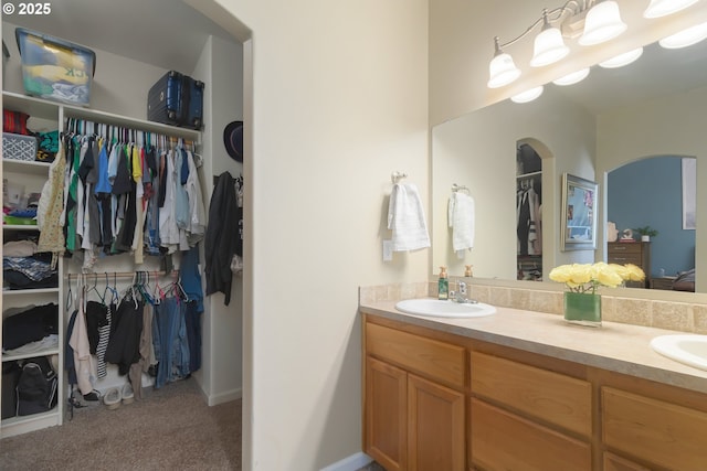 1281 Alderdale Dr, Junction City, OR 97448 - bathroom featuring double vanity and a walk in closet