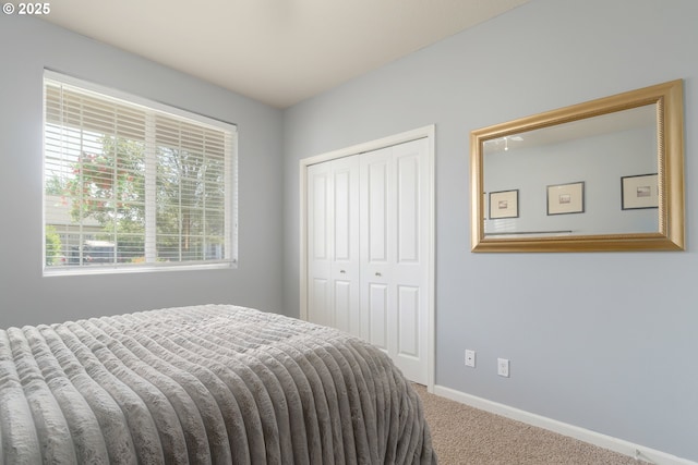 1281 Alderdale Dr, Junction City, OR 97448 - bedroom featuring carpet floors, a closet, and baseboards
