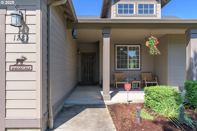 1281 Alderdale Dr, Junction City, OR 97448 - view of exterior entry with a porch and a shingled roof