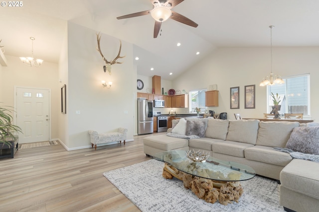 1281 Alderdale Dr, Junction City, OR 97448 - living area with a chandelier, high vaulted ceiling, light wood finished floors, recessed lighting, and ceiling fan