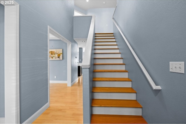 5836 NE Farnham St, Hillsboro, OR 97124 - stairs with wood finished floors, baseboards, and a towering ceiling