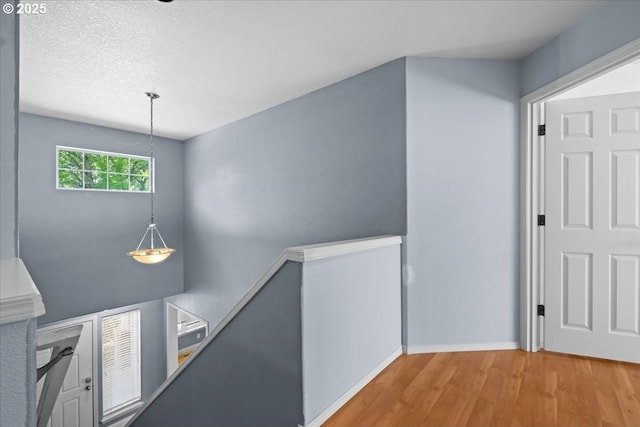 5836 NE Farnham St, Hillsboro, OR 97124 - corridor featuring an upstairs landing, wood finished floors, and baseboards