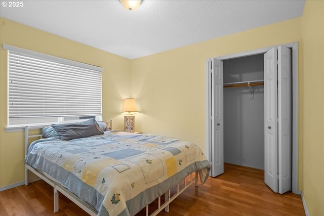 5836 NE Farnham St, Hillsboro, OR 97124 - bedroom with wood finished floors, a closet, and baseboards