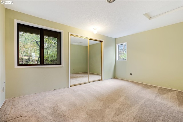 unfurnished bedroom featuring a closet and carpet