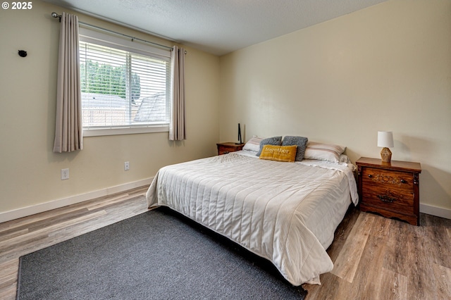 4075 A Loop, Washougal, WA 98671 - bedroom with wood finished floors, baseboards, and a textured ceiling