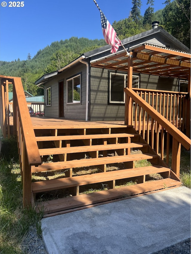 337 Main St, Scottsburg, OR 97473 - deck featuring stairs and a forest view