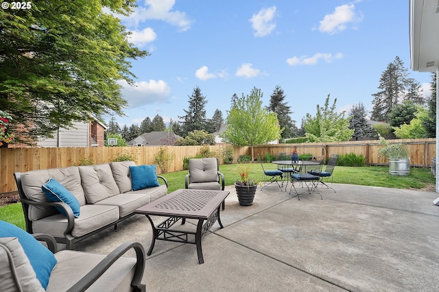 view of patio featuring a fenced backyard, outdoor lounge area, and outdoor dining space