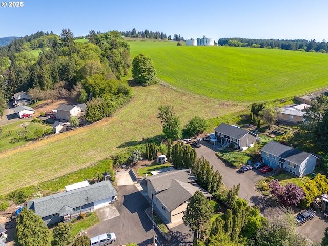 birds eye view of property with a rural view