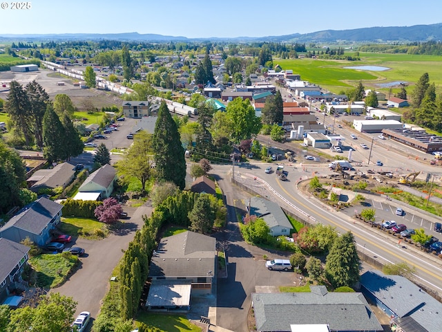 birds eye view of property with view of golf course, a residential view, and a water and mountain view