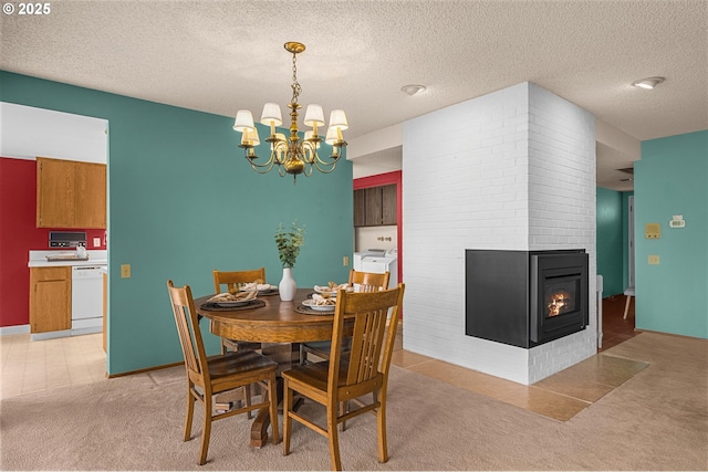 dining space with a textured ceiling, light colored carpet, and a notable chandelier