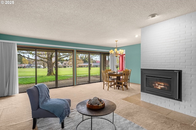 living area with carpet floors, a multi sided fireplace, a chandelier, and a textured ceiling