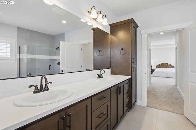 29169 NW King St, North Plains, OR 97133 - bathroom featuring a sink, tile patterned flooring, a shower stall, and double vanity