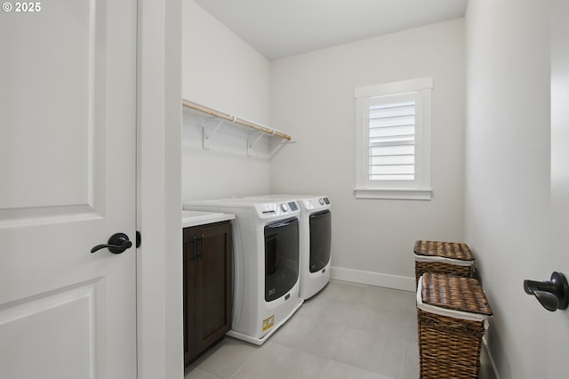 29169 NW King St, North Plains, OR 97133 - laundry area with baseboards, cabinet space, and washer and dryer