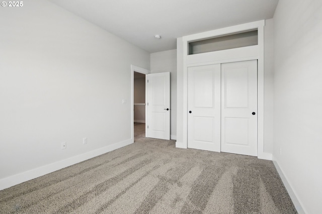 29169 NW King St, North Plains, OR 97133 - unfurnished bedroom featuring carpet flooring, baseboards, and a closet