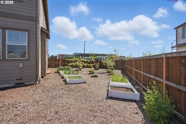 29169 NW King St, North Plains, OR 97133 - view of yard featuring a fenced backyard and a vegetable garden