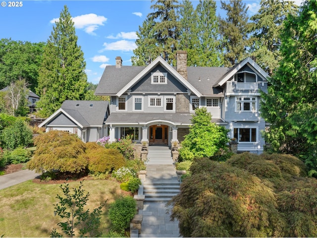 1314 SE 55th Ave, Portland, OR 97215 - shingle-style home with a chimney, a shingled roof, and a porch