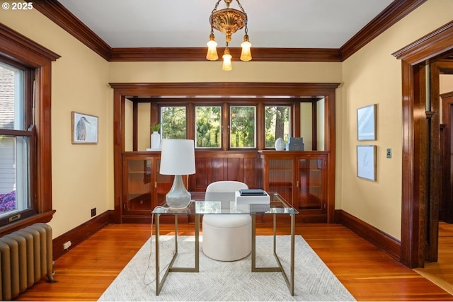1314 SE 55th Ave, Portland, OR 97215 - office space with radiator heating unit, wood finished floors, ornamental molding, baseboards, and a chandelier
